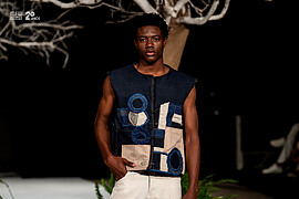 Donell Banze model. Photoshoot of model Donell Banze demonstrating Fashion Modeling.Mozambique Fashion Week runway show 2025. Zimbabwe designer Kuki SanbanBrand: SoleilFashion Modeling Photo #249111